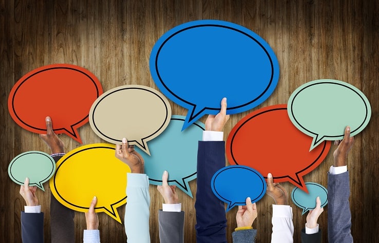 Group of Hands Holding Speech Bubbles