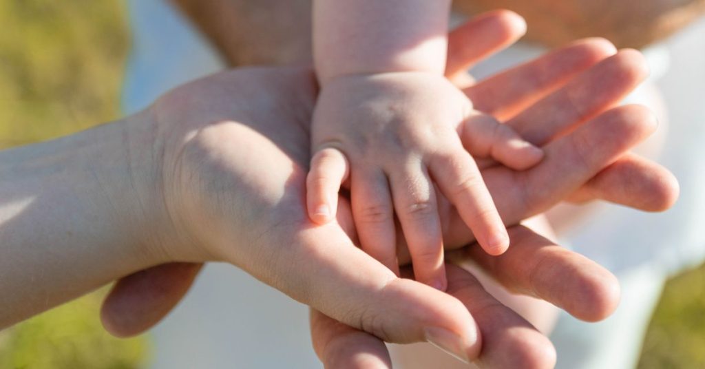 Parents with child's hand